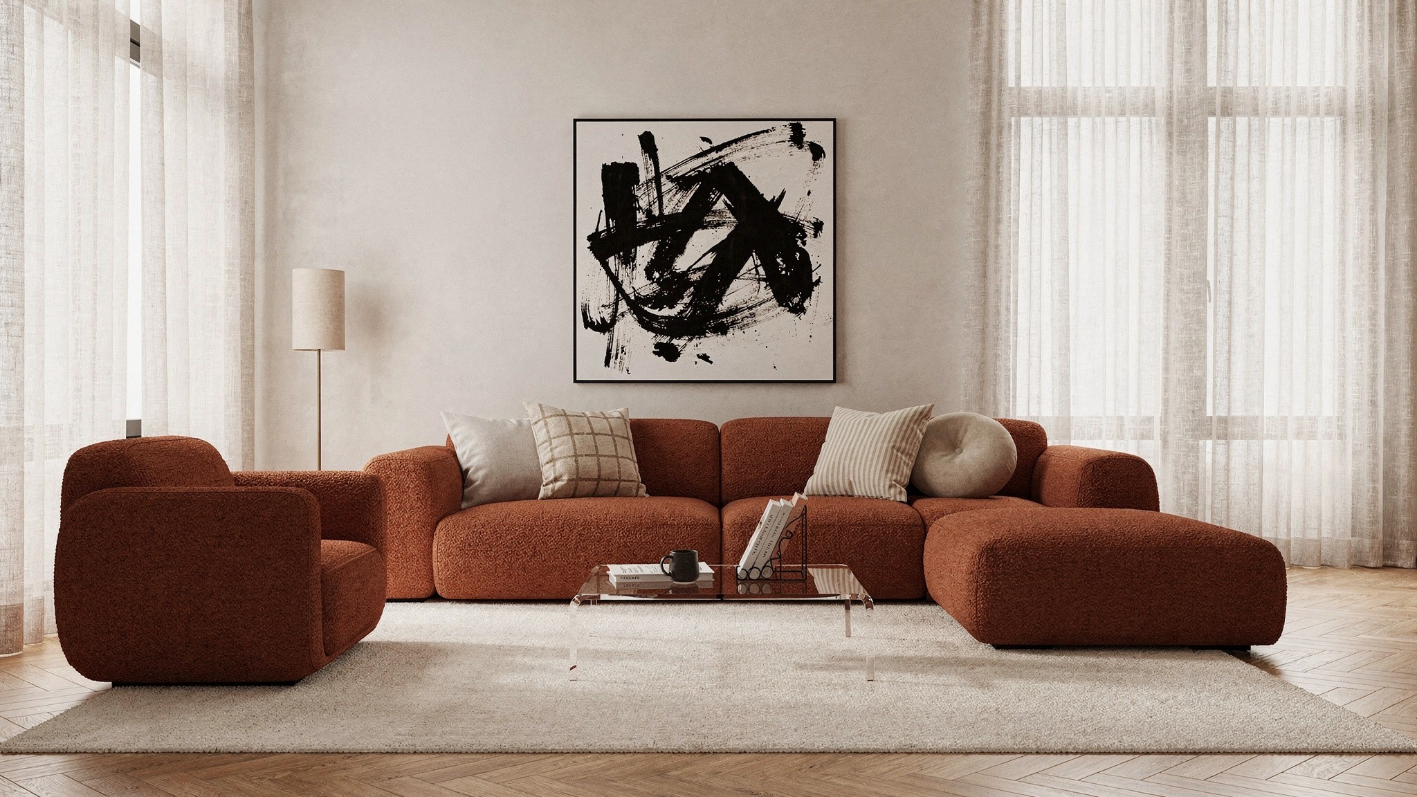 A cream bouclé armchair with a looped, nubbly texture beside a smooth linen sofa in warm afternoon light
