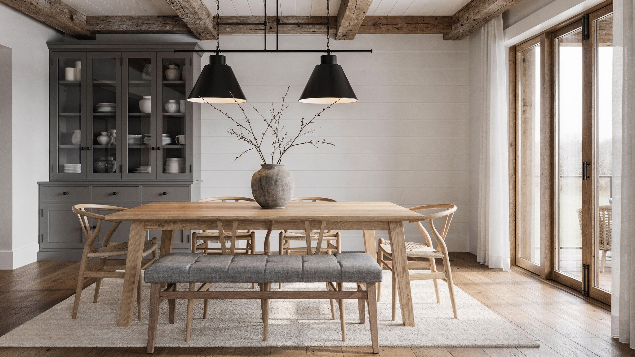 Close-up of oak and walnut surfaces side by side in natural daylight, showing how both read as neutral brown without orange or grey clash