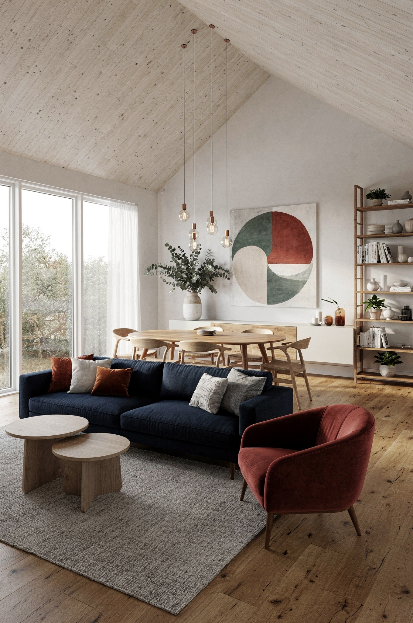 A warm Scandinavian living room with a tan leather sofa, oak floor, wool throw and a single pendant lamp